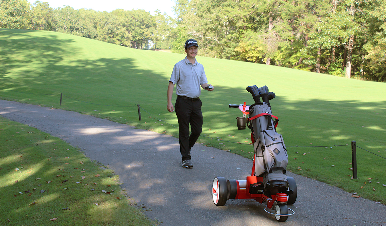 Walking the cart path with the Kangaroo remote lithium golf caddy