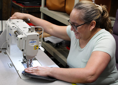 Gallery seat being sewn by Rena at Kangaroo NC factory